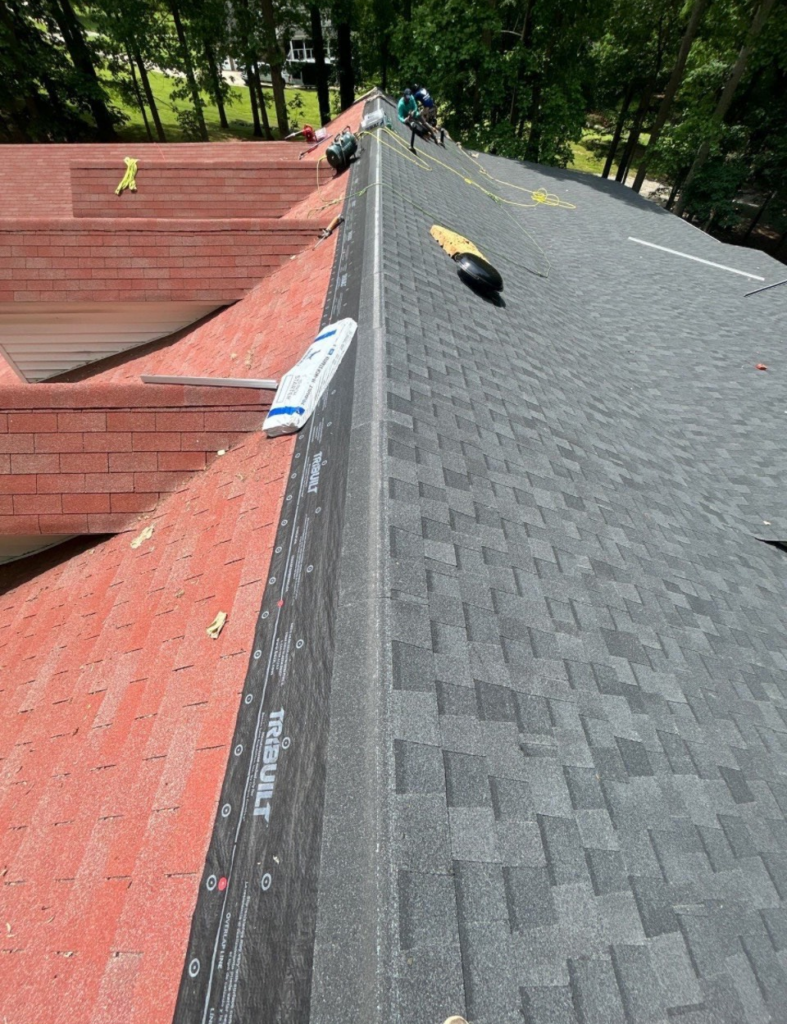Side-by-side roof comparison showing shingle replacement progress during roofing in Cherryville, NC.