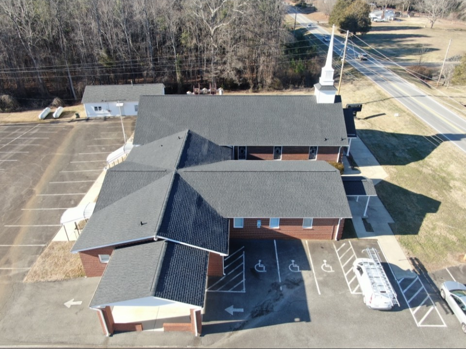 : Aerial view of a completed commercial roofing project, demonstrating quality roofing in Cherryville, NC.